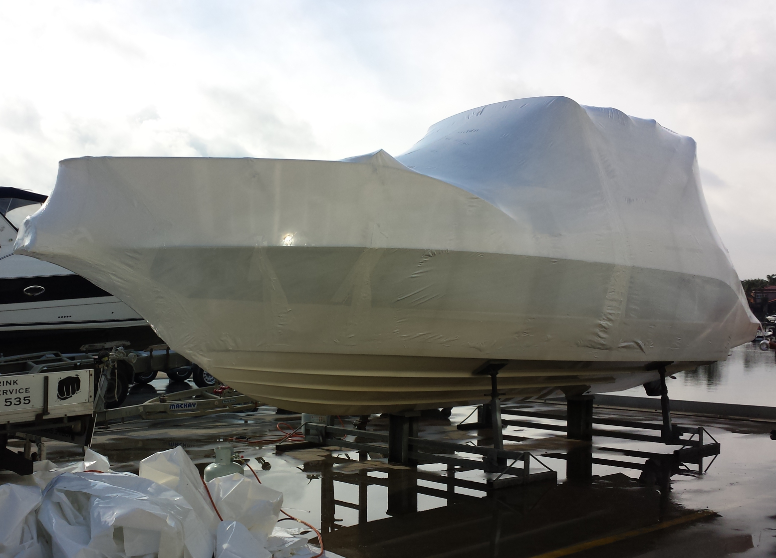 After photo: Marine vessel fully encapsulated in heavy-duty shrink wrap for weather protection