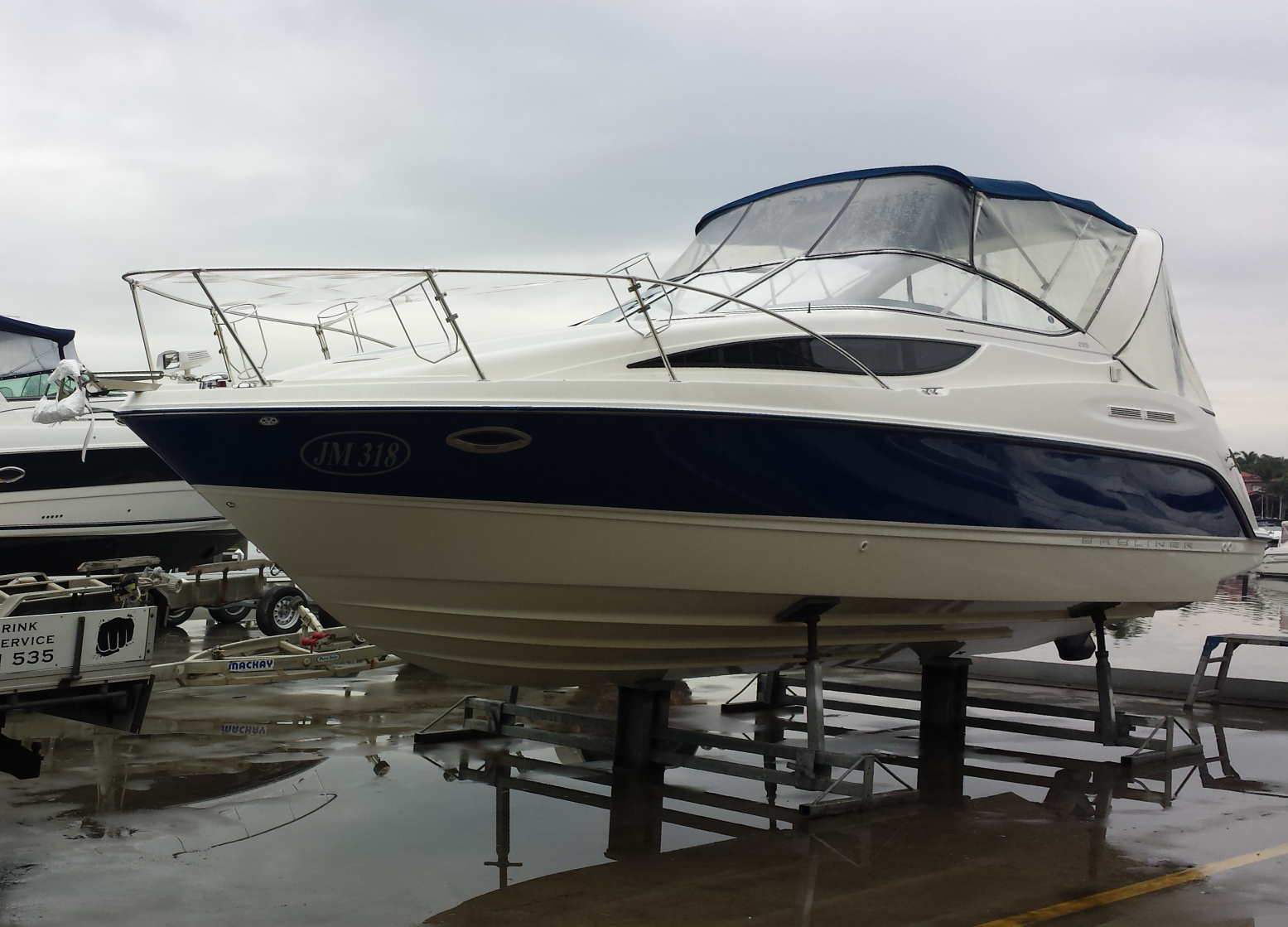 Unprotected Bayliner cabin cruiser on hardstand cradles ready for Tufwrap marine shrink wrap application